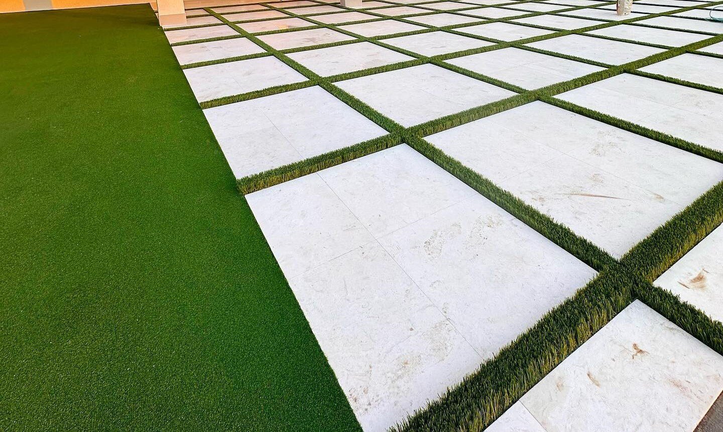 Artificial grass tiles and wall panels in modern interior